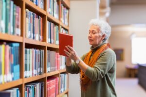 Woman holding red book