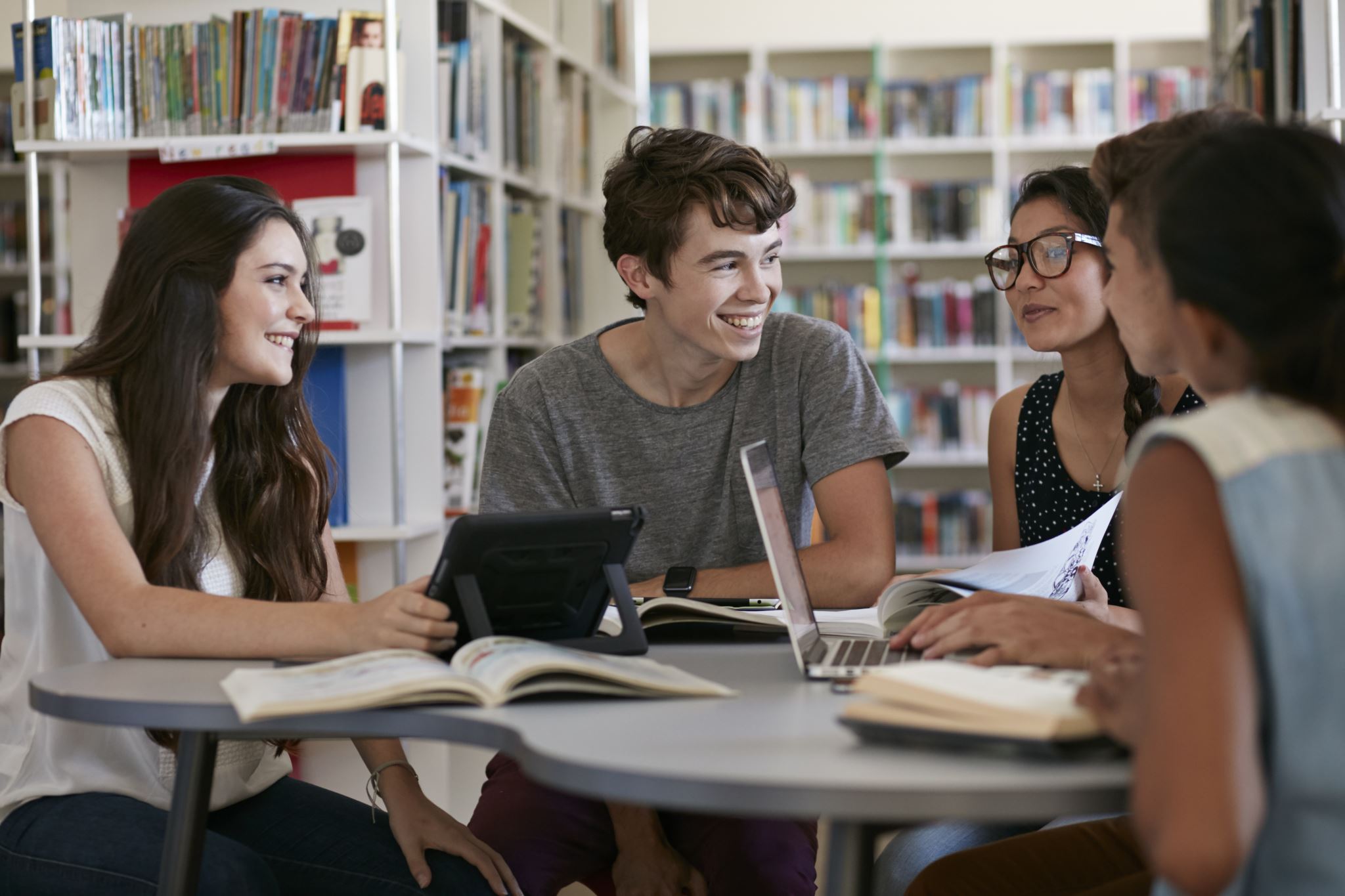 Group of students working in library