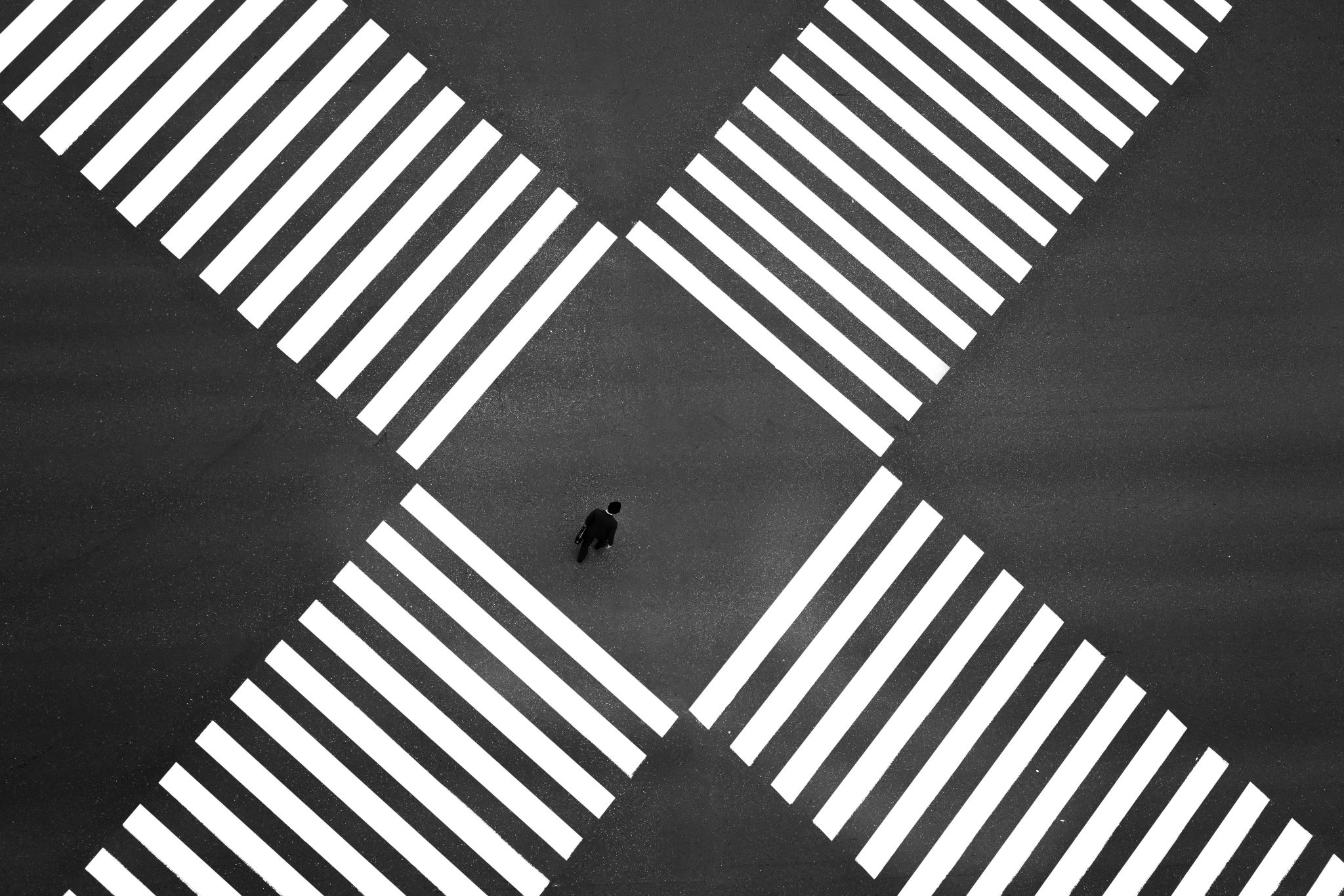 Large walking intersection with one lone person